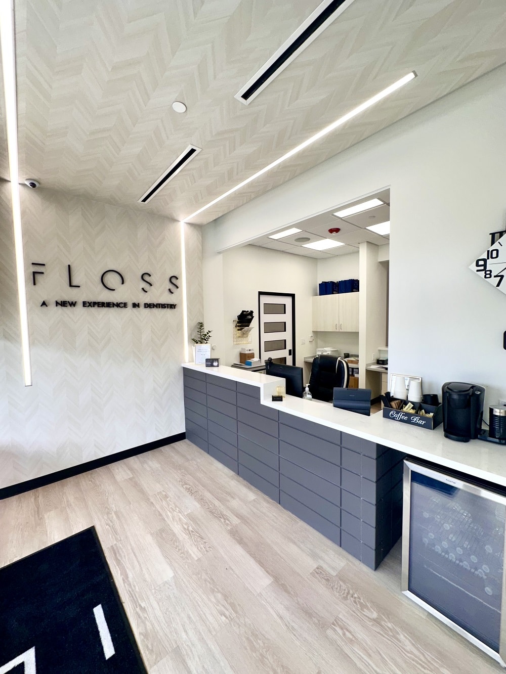 Reception area of FLOSS Dental Sugar Land, showcasing comfortable seating and modern decor